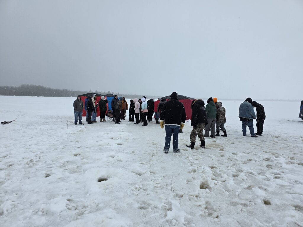 February 23, 26, and 27 students and staff at Ojibwe Charter School participated in an ice fishing field trip coordinated by the Inter-Tribal Council of Michigan and Bay Mills Indian Community Biological Services at Waiska Bay with support from the NOAA B-WET program to learn about ice fishing traditions and local watersheds.