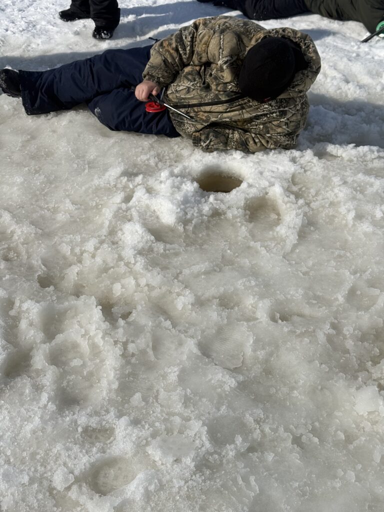 February 23, 26, and 27 students and staff at Ojibwe Charter School participated in an ice fishing field trip coordinated by the Inter-Tribal Council of Michigan and Bay Mills Indian Community Biological Services at Waiska Bay with support from the NOAA B-WET program to learn about ice fishing traditions and local watersheds.