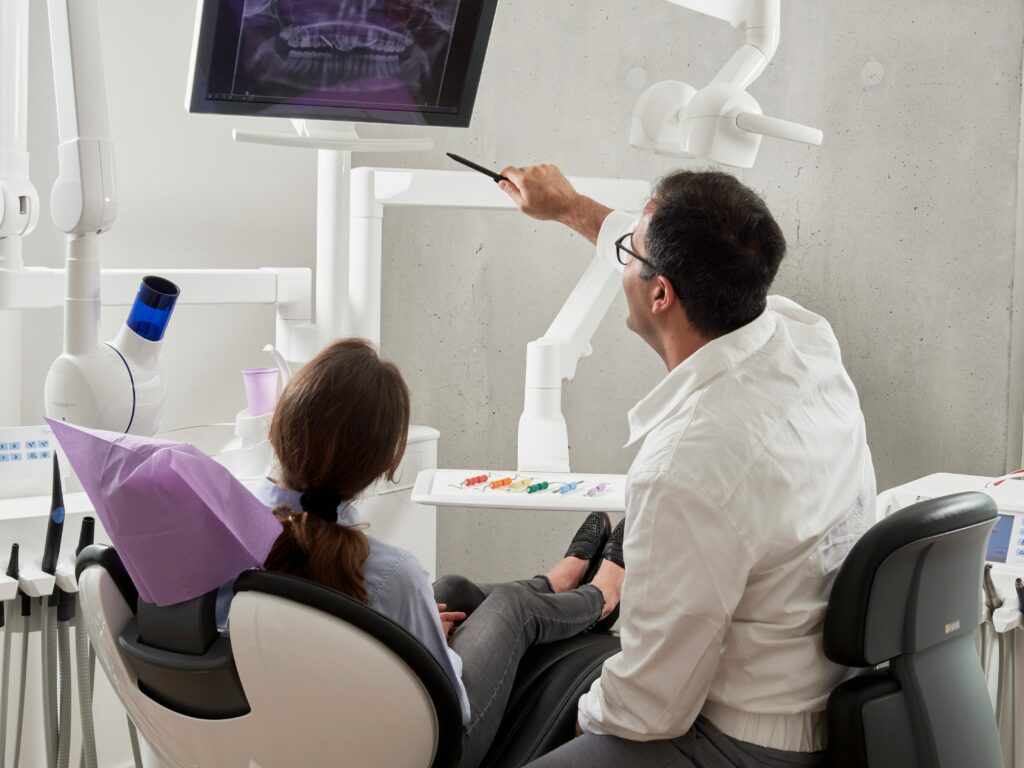 Patient and Dentist in exam room.