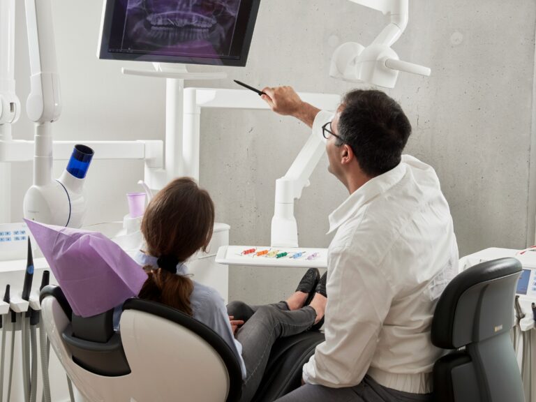 Patient and Dentist in exam room.